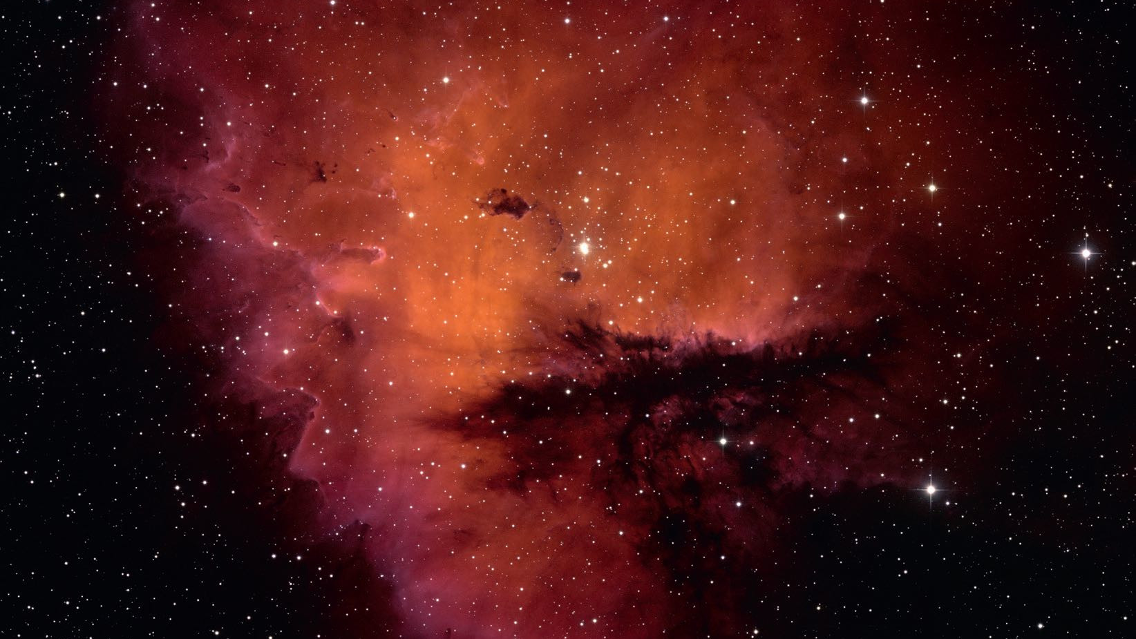 Forma nebuloase NGC 281 amintește de personajul Pacman nu doar din punct de vedere fotografic, ci și vizual. NSF/AURA/WIYN/T. Rector (University of Alaska)